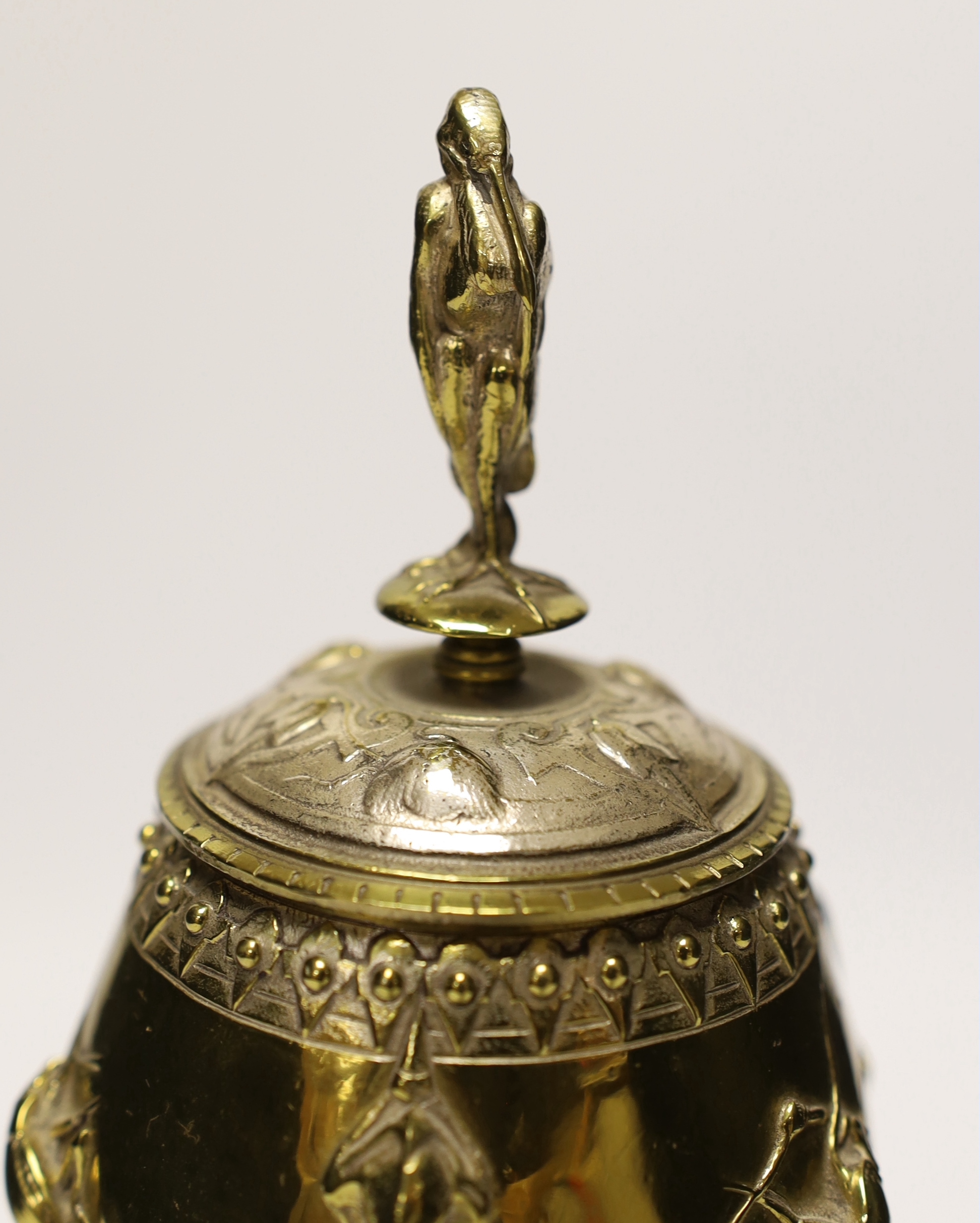 A brass and plated goblet and cover raised on circular slate base, body signed A Cain, 25cm high